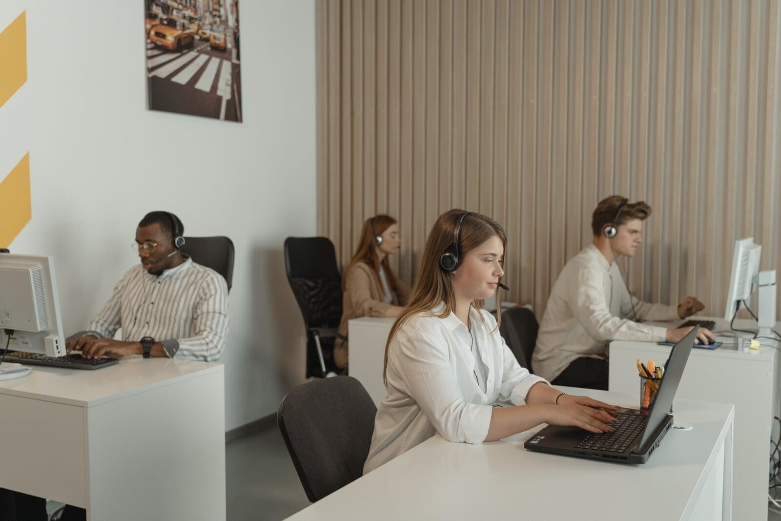 Employees Peforming Lead Management at Computer Stations